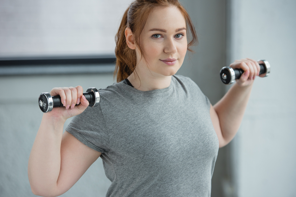 young woman exercise to treat pcos naturally