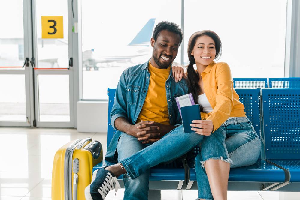 young couple at airport with fertility medications