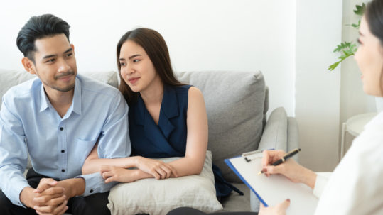 asian couple seeing fertility counseling